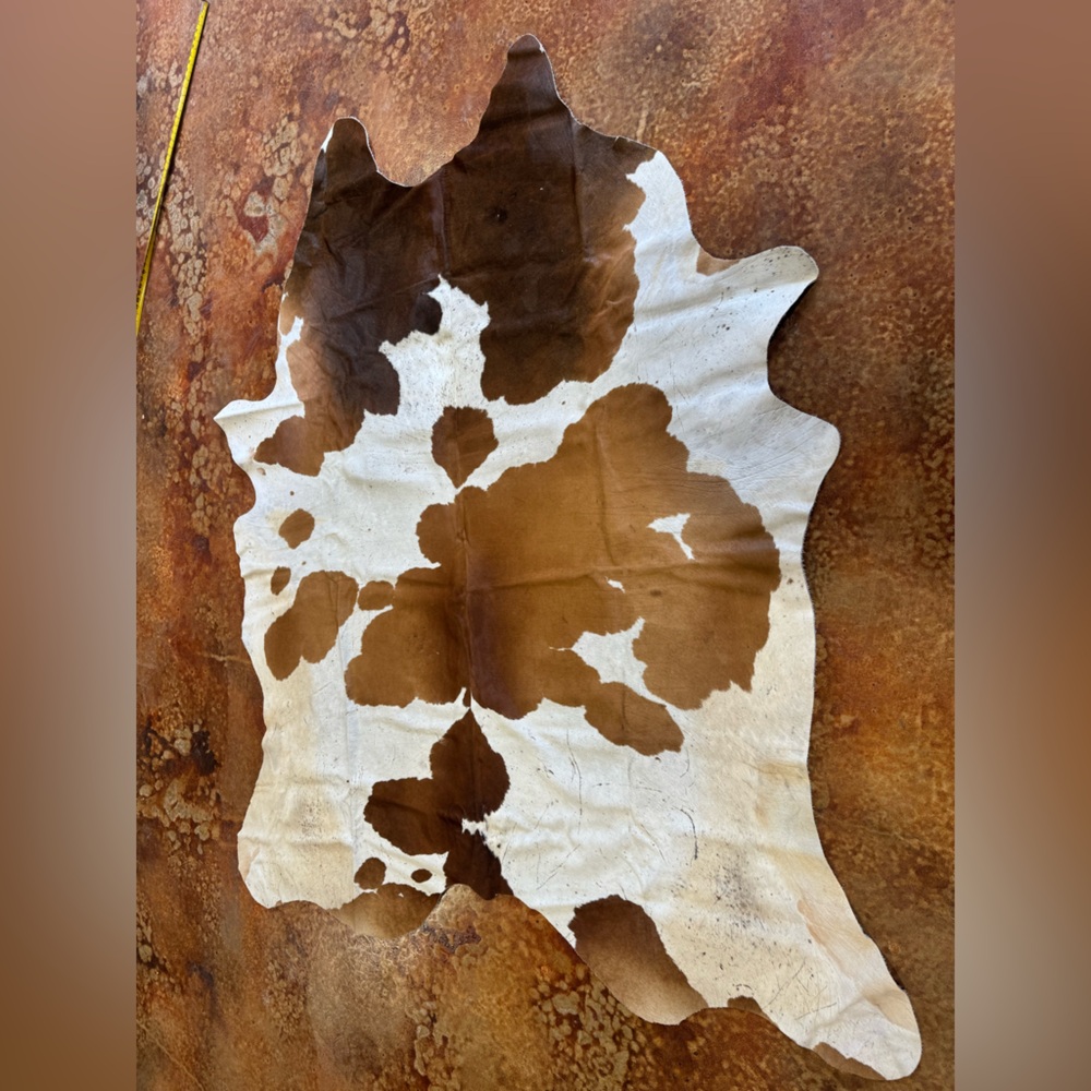 Brown and White Cowhide Rug